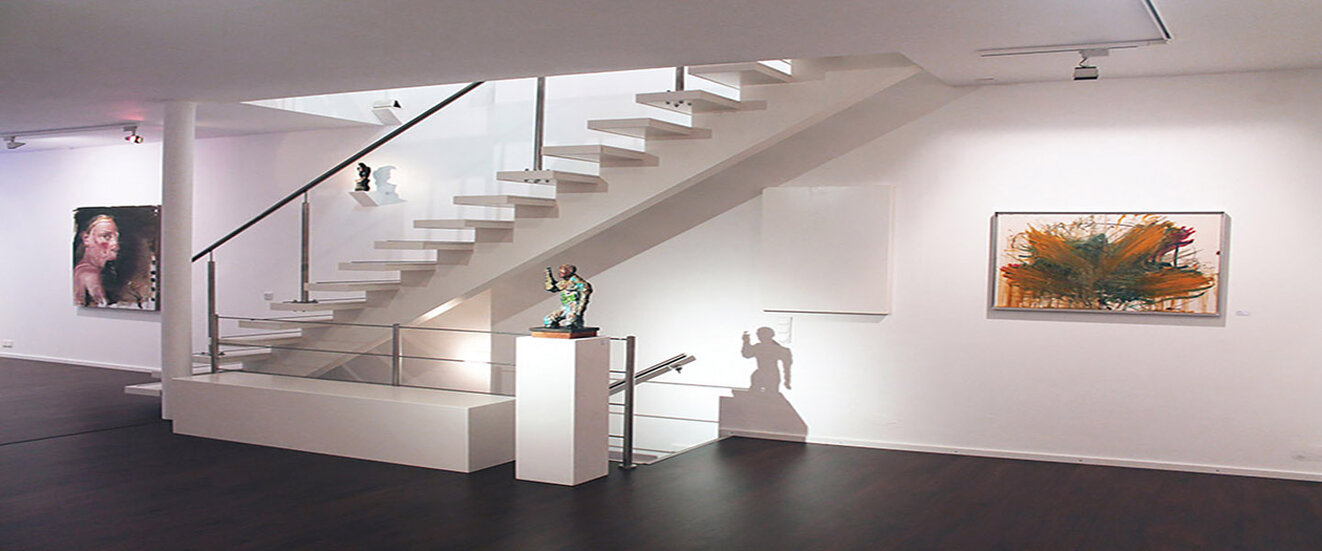 It shows a picture of an exhibition in the gallery with Mike MacKeldey, Markus Lüpertz and Arnulf Rainer.
